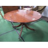 Victorian mahogany circular tilt-top table on pedestal on 4 reed legs to brass claw feet &