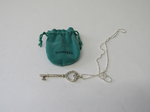 Tiffany & Co key pendant on chain. Estimate £10-20.
