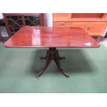 Regency mahogany tilt-top breakfast table on pedestal to 4 legs on brass castors, 121cms x 85cms x