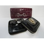 Authentic DKNY patent purse with large enamelled badge at front; authentic Ted Baker buckle purse