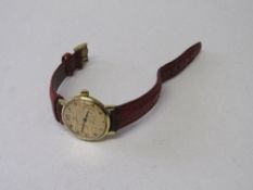 Omega Geneve watch with red leather strap, going order. Estimate £40-60.