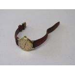 Omega Geneve watch with red leather strap, going order. Estimate £40-60.