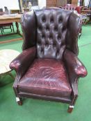 Leather 2 seat button back sofa & 2 button back winged armchairs. Estimate £150-180.