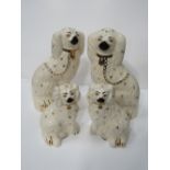 A pair of Beswick Staffordshire dog figurines & a pair of Beswick miniature Staffordshire dog