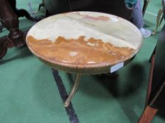 Circular onyx top on brass base side table, 60cms diameter. Estimate £30-40.