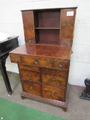 Small flame mahogany writing desk, fold-over tops, storage below over 6 graduated drawers, 61cms x