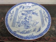 19th century blue & white oriental style plate, 43cms diameter (has been repaired). Estimate £30-