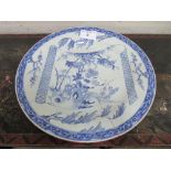 19th century blue & white oriental style plate, 43cms diameter (has been repaired). Estimate £30-