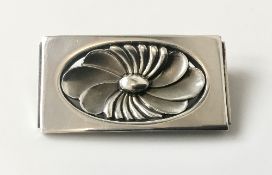 A rare Georg Jensen brooch designed by Henry Pilstrup, stepped rectangular silver with lotus