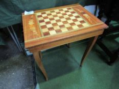 Chess set in a cheque board table on cabriole legs. Estimate £10-20.