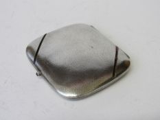 A hammered silver & garnet decorated (most missing) cigarette case marked C de Ansorena Hijos 900.
