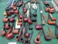 Large collection of smoker's pipes, various hooka pipes & 3 ceramic pipe bowls. Estimate £40-60.