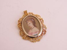 18ct gold pendant with portrait of a young lady, height 4cms, weight 8.4gms. Estimate £350-450.