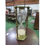 Very large brass sand glass, height 54cms. Estimate £20-30.