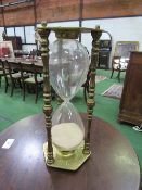 Very large brass sand glass, height 54cms. Estimate £20-30.