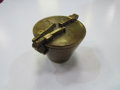 German brass nesting weights (possibly one missing). Estimate £80-100.