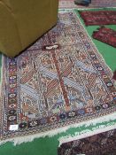 Old Afghan rug with animal & geometric designs, 186 x 120. Estimate £30-50.