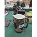 Large brown pottery jug & a copper coloured resin figure of a lady & a dog. Estimate £10
