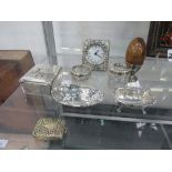 2 small hallmarked silver dishes; 2 hallmarked silver top glass pots; silver cased quartz clock;