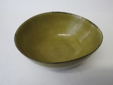 Lucie Rie (1902-1995). A mustard yellow glazed Lucie Rie bowl with manganese rim. Impressed seal LR,