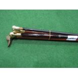 4 walking sticks, 1 with hidden flask, 1 with silver top & 2 with duck heads. Estimate £15-20.