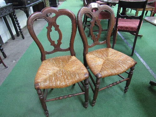 Pair of 1860/1890 walnut dining chairs with carved splat backs. Estimate £30-50.