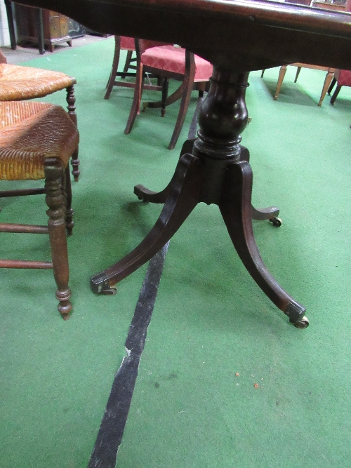 Regency mahogany tilt-top breakfast table on pedestal to 4 legs on brass castors, 121cms x 85cms x - Image 4 of 4