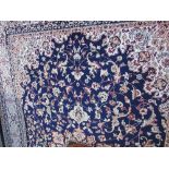 Blue ground Keshan carpet, 3m x 2m. Estimate £80-100.