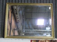 Gilt framed bevel edge mirror, 86cms x 102cms. Estimate £40-60.