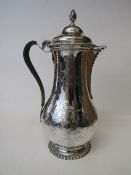 George III hallmarked silver coffee pot, engraved with flowers & swags, leather handle, by John