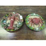2 late 18th century Palissy ware plates decorated with a crab & a lobster, (lobster a/f), 31cms