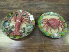 2 late 18th century Palissy ware plates decorated with a crab & a lobster, (lobster a/f), 31cms