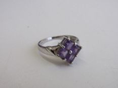 9ct white gold & purple stone ring, size N 1/2, weight 3gms. Estimate £30-50.