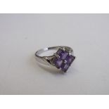 9ct white gold & purple stone ring, size N 1/2, weight 3gms. Estimate £30-50.