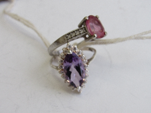 2 silver rings with amethyst & topaz stones, both size Q. Estimate £50-60.