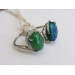 2 silver rings with blue/green stone & green stone, size O & Q. Estimate £50-60.