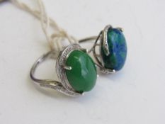 2 silver rings with blue/green stone & green stone, size O & Q. Estimate £50-60.