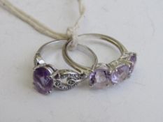 2 silver rings with amethyst & pink stones, both size Q. Estimate £25-30.