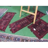 3 small red ground Afghan (Herat) rugs. Estimate £20-30.