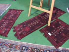 3 small red ground Afghan (Herat) rugs. Estimate £20-30.