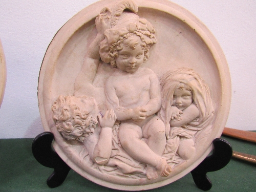1 Putti circular plaque signed E W Wyon & 1 other not signed. Estimate £30-50. - Image 2 of 3