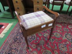 Mahogany piano with upholstered rising lid & handles. Estimate £20-30.