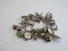 Sterling silver charm bracelet including Beatles charm inscribed Yeah Yeah Yeah, weight 2.7ozt.