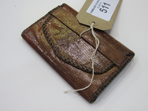 Snake skin wallet. Estimate £40-50.