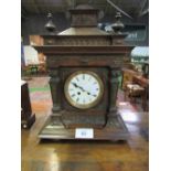 Small Art Deco style mantel clock & a highly decorated mantel clock. Estimate £40-60.