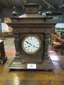 Small Art Deco style mantel clock & a highly decorated mantel clock. Estimate £40-60.