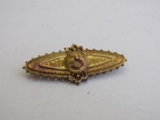 Victorian 15ct gold, ruby & diamond brooch, 4.5cms length, weight 3.7gms. Estimate £125-250.