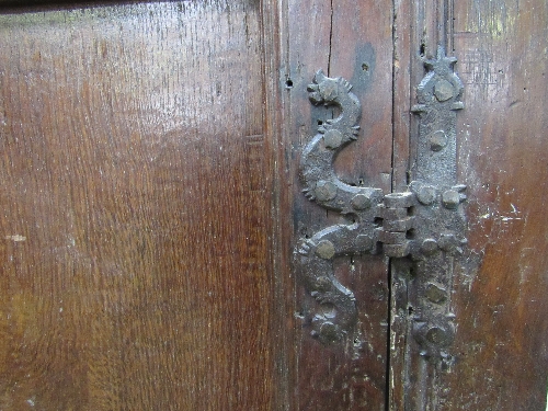 Large oak 17th century hanging cupboard, double doors, gouge carving to top, hanging pegs to - Image 4 of 6