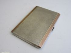 Hammered silver cigarette case, Birmingham 1921 by Suckling Ltd, inscribed inside, 12.5cms x 8.5cms.