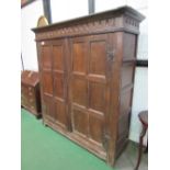 Large oak 17th century hanging cupboard, double doors, gouge carving to top, hanging pegs to